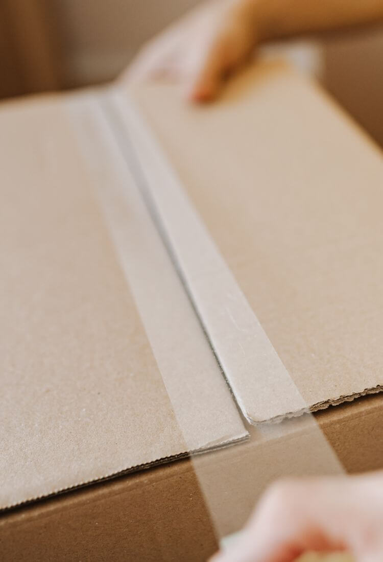 A shipping box perfectly sealed with our professional-grade packing tape, ensuring the contents are safe and secure for transit.